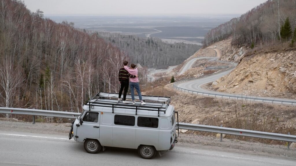 long-shot-people-standing-van_23-2149005016